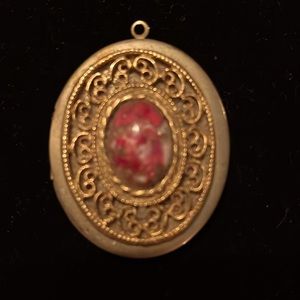 Antique gold tone locket